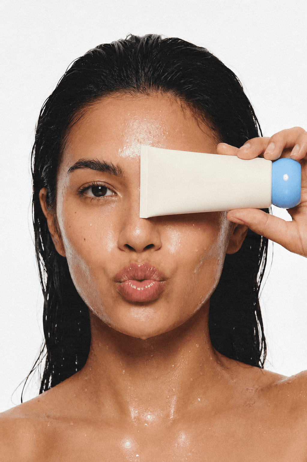 Woman combing conditioner through wet hair for scalp care